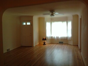 Living room as seen from inside dining area. Front door is to the left.