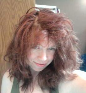 This is what hubby wakes up to in the morning. This is the "realistic" pic of me. :) It kind of looks like I'm wearing a REALLY bad weave. Yikes!  But...hey, I'm not making a weird face.  Yay!!!